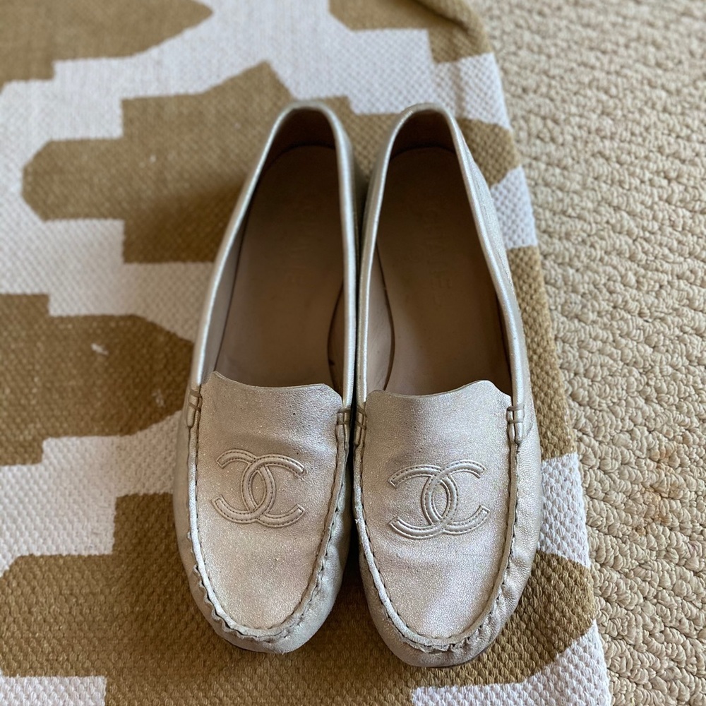 Gold Chanel loafer flats